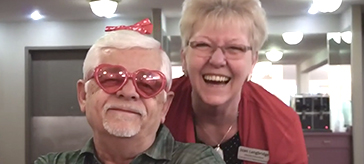 photo of a resident and a team member from Kensington Court Retirement Residence enjoying the Valentine celebration event.