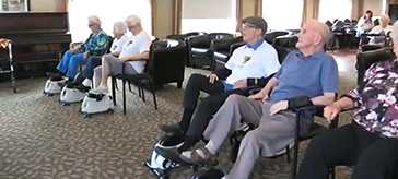 picture of residents of Cedarvale Lodge Retirement Residence virtually cycle around the world
