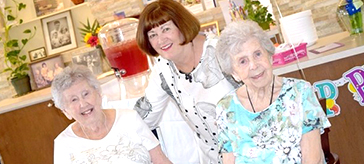 photo of Anna Smith, right, celebrates her 100th birthday with sister Flo Moore and daughter Francie Heagney, at Island View Suites. 