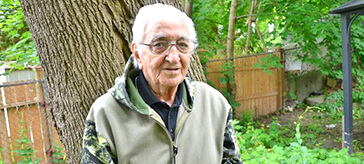image of Douglas stood in the garden of his retirement residence