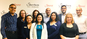 image of team members of Silverthorn Care Community smile towards the camera during the 2018 Access Award ceremony.