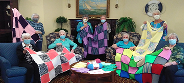 The knitting group from Waterford Barrie Retirement Residence enjoys giving back to the community and hanging out every Tuesday.