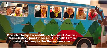 Group photo of residents arriving to camp in The Shores camp bus.