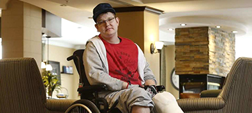 image of Craig Beaton who broke his legs in the OC Transpo bus crash and is convalescing at Red Oak Retirement Residence.