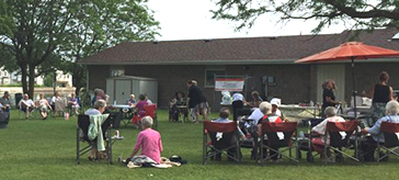 picture of residents of Island Park Retirement Residence enjoyed the barbecue at Old Mill Park and helped raise money at the same time.