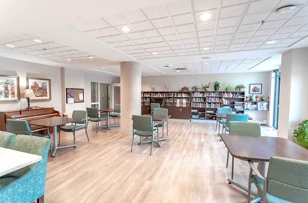 Library with piano at Island View Retirement Residence in Arnprior