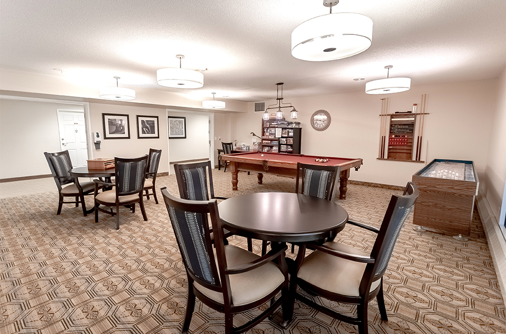 Seating area in the game room at Masonville Manor Retirement Residence in London