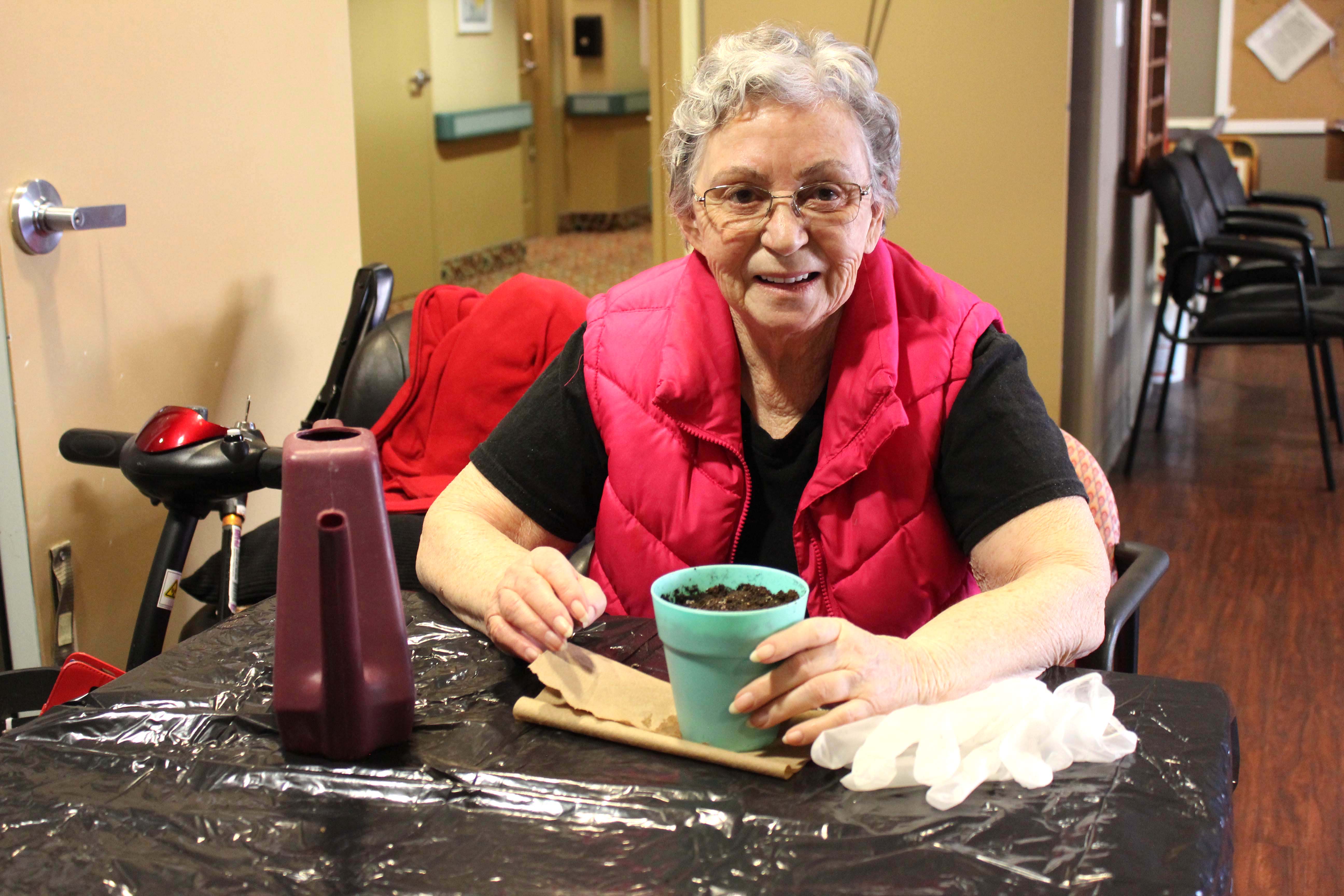 A resident planting seedlings.  