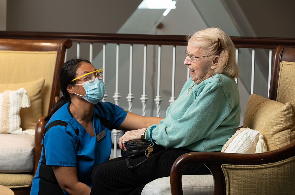 Nurse caring for elderly woman at the residence
