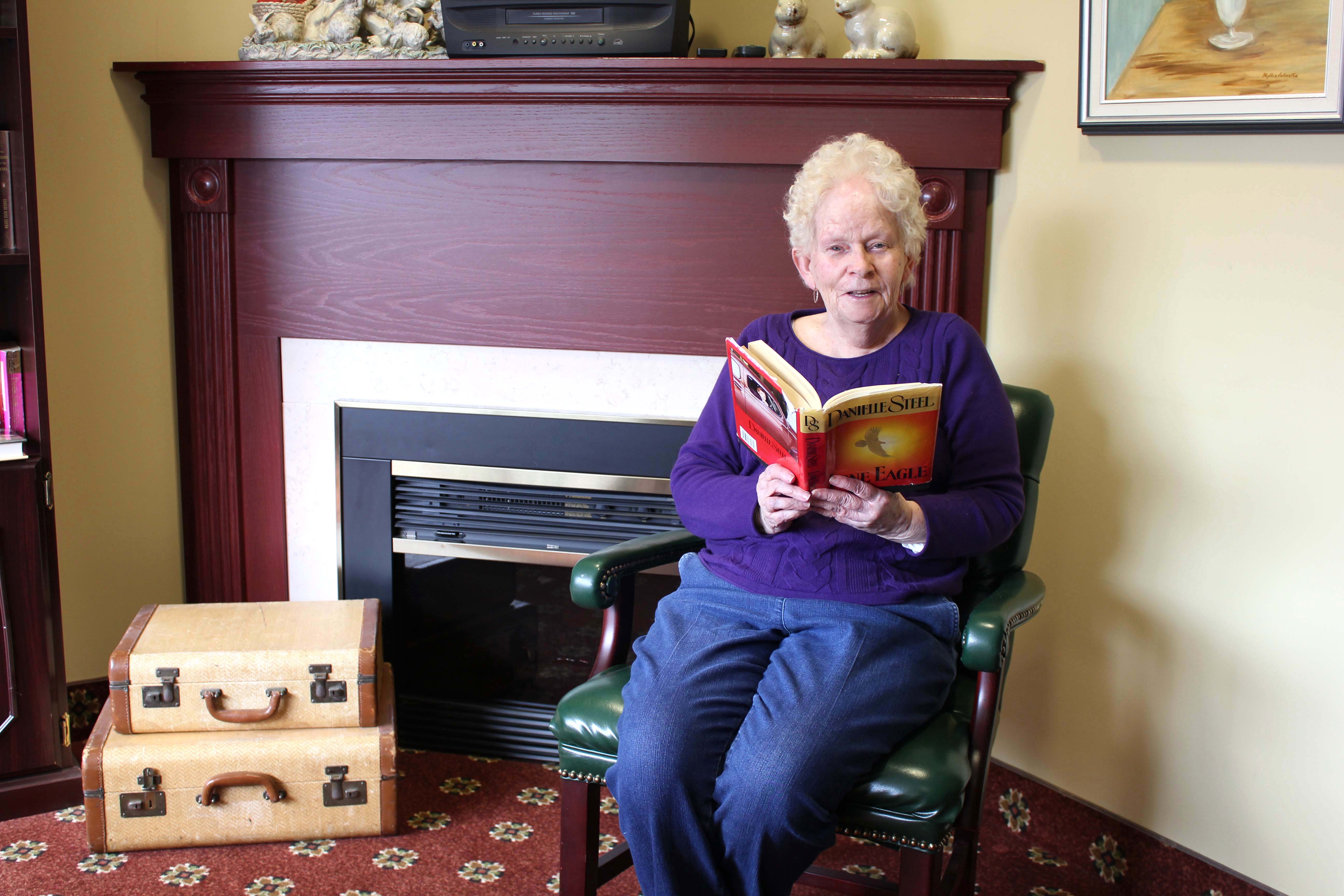 A woman reading a book. 