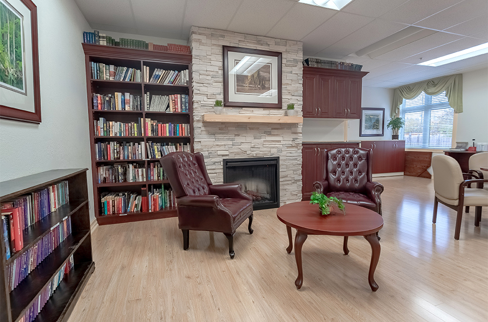 Seating area in the library at Kawartha Lakes Retirement Residence in Bobcaygeon