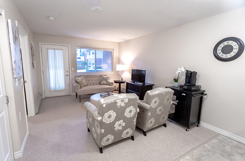The TV area with couches in one of the suites at Masonville Manor Retirement Residence in London