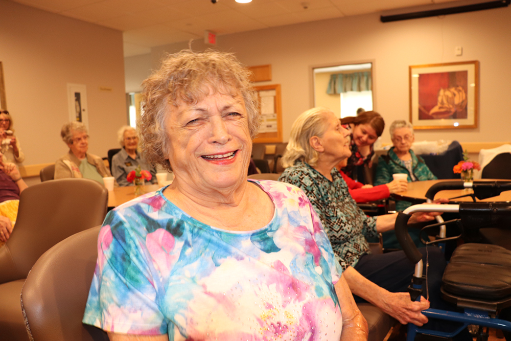 A lady laughing.