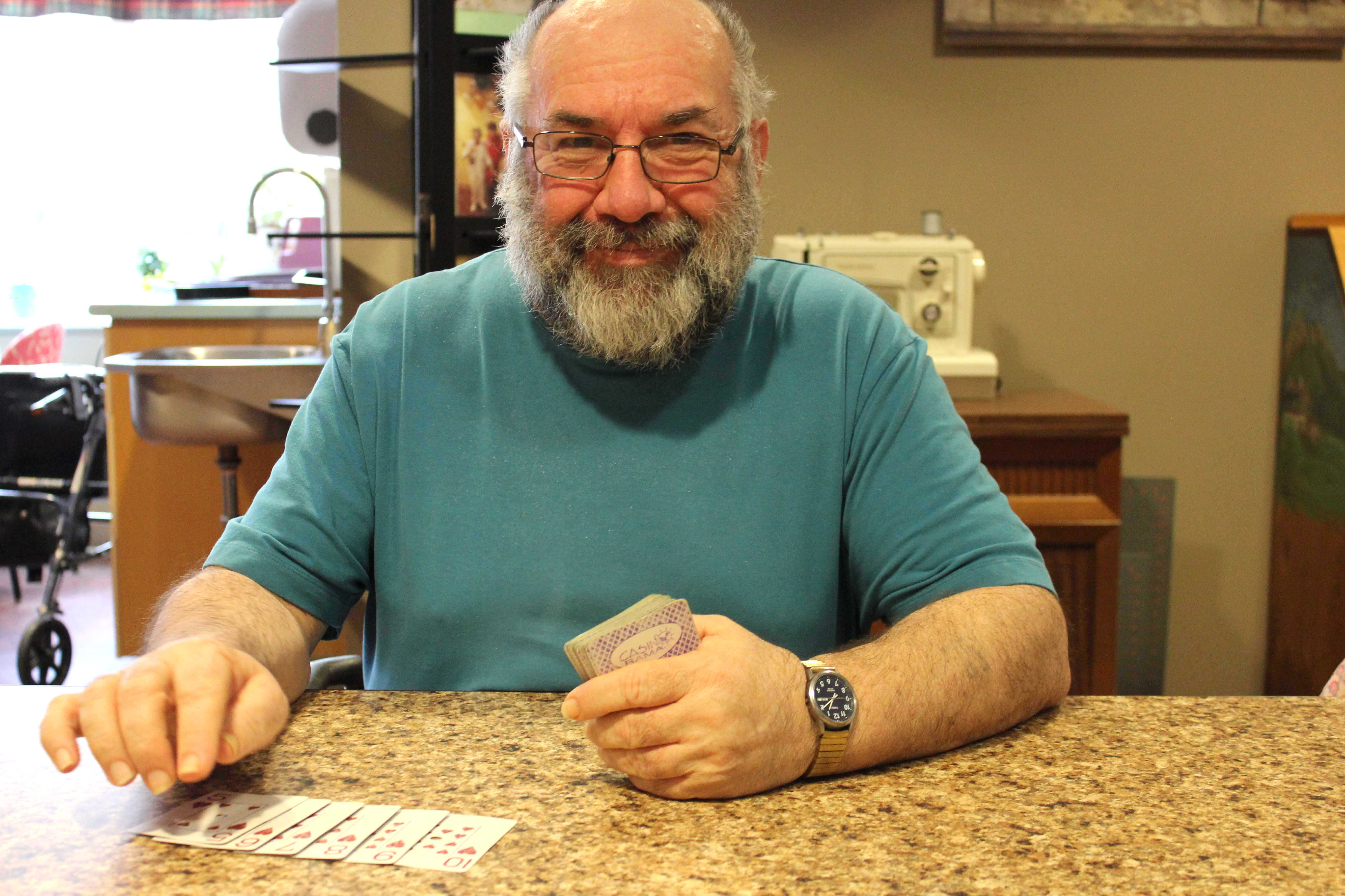 A man playing cards.