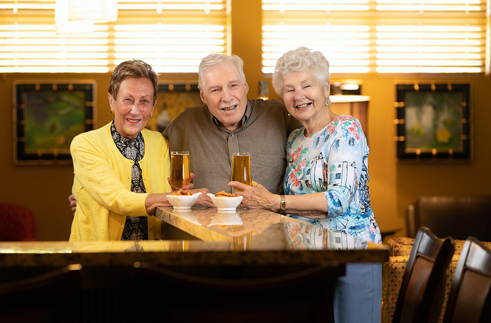 Group of elderly people sharing a drink