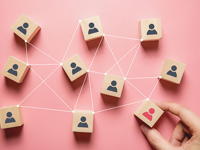 image of person holding blocks that are connected