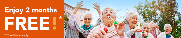 image of a group of female seniors blowing bubble cheerfully in an outdoor setting
