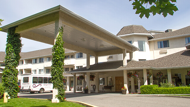 exterior shot of Okanagan Chateau Retirement Residence in Kelowna, BC