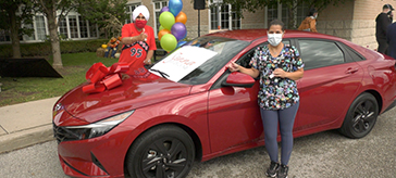 Personal Support Worker Sonia Botas wins a new car in a vaccine contest in Bradford West Gwillimbury