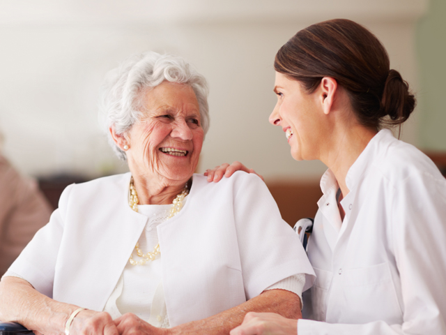 Nice interaction between elderly woman and care worker