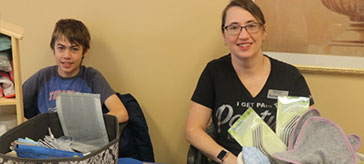 Shari with Norwex with her son Wesley helping out at Bradford Valley's Annual Christmas Bazaar.