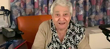 image of one of the female resident at St. George Care Community enjoying a special playlist just for her