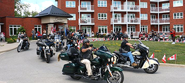 More than 100 vehicles streamed past Carolina Retirement Residence in Perth on Sunday, July 4, as a sign of respect and love for the men who celebrated birthdays this year. 