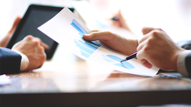 close up.businessman and assistant checking financial report.