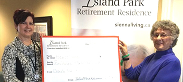 Cindy McMurray, left, Retirement Counsellor, Island Park Retirement Residence, and resident Teresa Weir, hold a giant cheque for the total amount of the donation to the Heart and Stroke Foundation