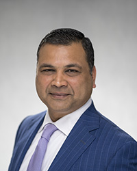 headshot of Nitin Jain - President and CEO