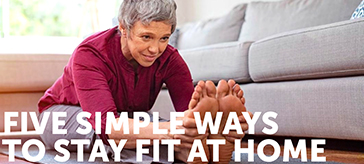 image of a female senior doing leg stretch at home