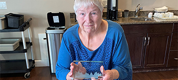 Eve poses with award the received for her LEAP nomination