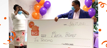 Image of Nitin, CEO of Sienna giving the cheque of $10,000 to PSW Marcia Palmer at St. George Care Community 