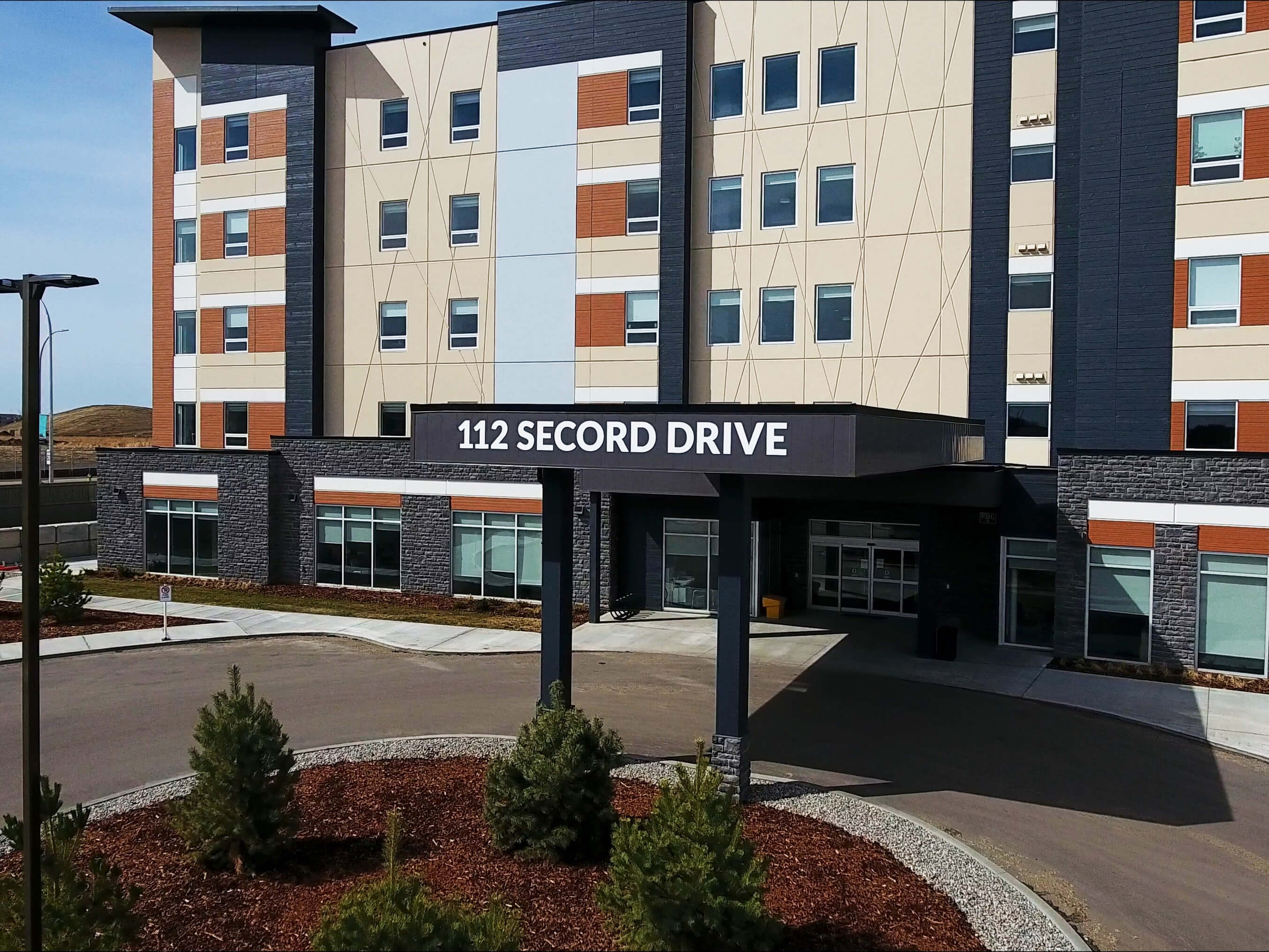 image of the front entrance of Brookside Lodge Care Community in Surrey