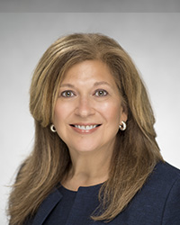 headshot of Olga Giovanni - Executive Vice President, People and Culture